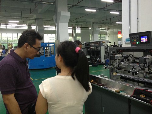 Indonesia Customer coming and ordering on the fully automatic UV screen Printer